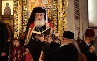 Greek Orthodox Patriarch of Jerusalem Theophilos III leads mass at the Nativity Church in the biblical city of Bethlehem, during Epiphany celebrations on January 6, 2024. (Photo by MOSAB SHAWER / AFP) (Photo by MOSAB SHAWER/AFP via Getty Images)