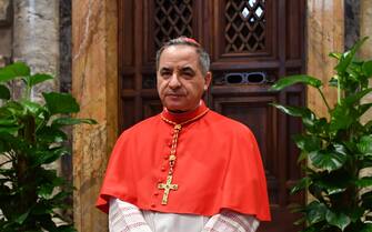 Newly elevated cardinal, Giovanni Angelo Becciu from Italy, attends the courtesy visit of relatives following a consistory for the creation of new cardinals on June 28, 2018 in the Apostolic Palace at St Peter's basilica in Vatican. (Photo by ANDREAS SOLARO / AFP) (Photo by ANDREAS SOLARO/AFP via Getty Images)