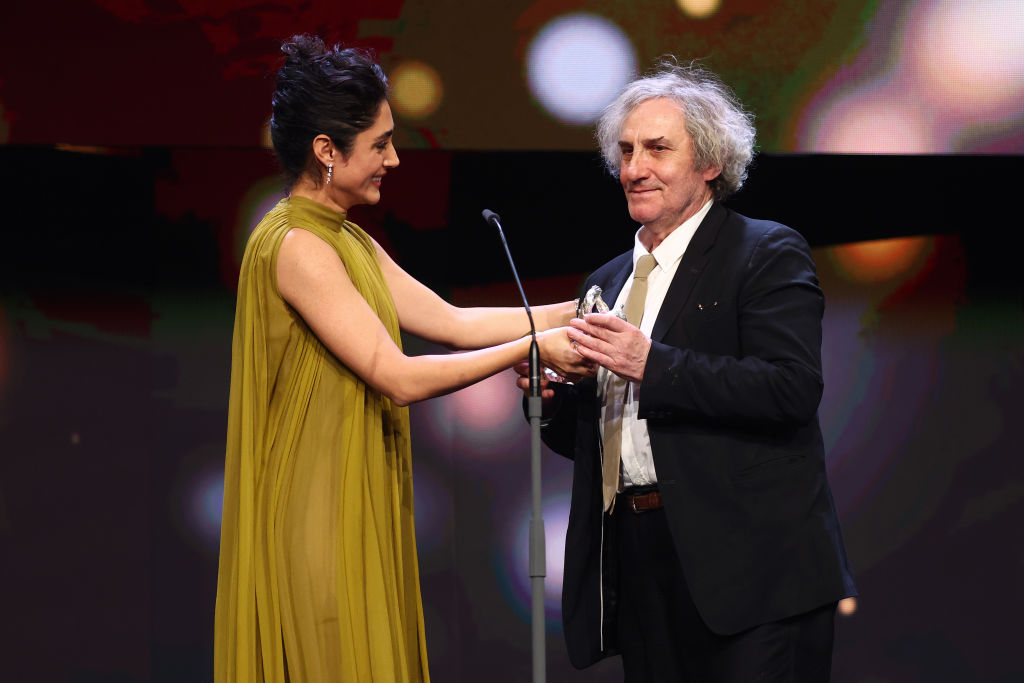 BERLIN, GERMANY - FEBRUARY 25: Member of the international jury Golshifteh Farahani hands over the Silver Bear for Best Director for his film "Le grand chariot" (The Plough) to Philippe Garrel on stage at the award ceremony of the 73rd Berlinale International Film Festival Berlin at Berlinale Palast on February 25, 2023 in Berlin, Germany. (Photo by Sebastian Reuter/Getty Images)