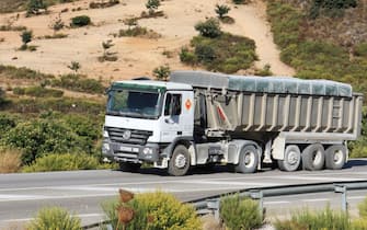 A heavily laden truck on the mountainous A397 road from Ronda to Fuengirola, near Malaga, Spain