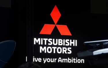 Signage for Mitsubishi Motors Corp. at the Tokyo Auto Salon in Chiba, Japan, on Friday, Jan. 13, 2023. The annual event at Makuhari Messe convention center runs through Jan. 15. Photographer: Kiyoshi Ota/Bloomberg via Getty Images