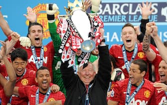 File photo dated 12-05-2013 of Manchester United manager Sir Alex Ferguson lifting the Barclays Premier League trophy. Issue date: Tuesday May 25, 2021.