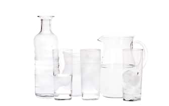 Studio picture of water jug, bottle and glasses with clipping path