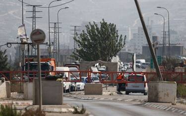 Israeli security forces close a road following a reported attack in the town of Huwara in the occupied West Bank, on August 19, 2023. Two Israelis were killed today in a suspected shooting attack in the occupied West Bank, the army said. (Photo by Jaafar ASHTIYEH / AFP) (Photo by JAAFAR ASHTIYEH/AFP via Getty Images)