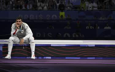 Italy's Filippo Macchi reacts after losing to Hong Kong's Cheung Ka Long in the men's foil individual gold medal bout during the Paris 2024 Olympic Games at the Grand Palais in Paris, France, 29 July 2024.
ANSA/ CIRO FUSCO