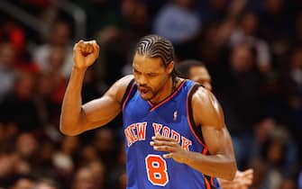 WASHINGTON - DECEMBER 7:  Latrell Sprewell #8 of the New York Knicks celebrates during the NBA game against the Washington Wizards at MCI Center on December 7, 2002 in Washington, DC.  The Wizards won 100-97.  NOTE TO USER: User expressly acknowledges and agrees that, by downloading and or using this Photograph, User is consenting to the terms and conditions of the Getty Images License Agreement.  Mandatory copyright notice:  Copyright 2002 NBAE  (Photo by: Mitchell Layton/NBAE via Getty Images)