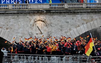 epa11497558 Atheltes from Germany wave their flags during the Opening Ceremony of the Paris 2024 Olympic Games, in Paris, France, 26 July 2024.  EPA/MOHAMMED BADRA