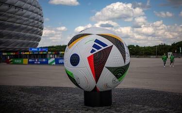 epa11407894 A giant official soccer ball replica on display outside the Allianz Arena, on the eve of the UEFA EURO 2024 opening match between Germany and Scotland, in Munich, Germany, 13 June 2024. The UEFA EURO 2024 runs from 14 June to 14 July in Germany.  EPA/MARTIN DIVISEK