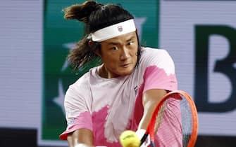 epa11382438 Zhizhen Zhang of China in action during his men's singles third round match against Stefanos Tsitsipas of Greece at the French Open Grand Slam tennis tournament at Roland Garros in Paris, France, 31 May 2024.  EPA/MOHAMMED BADRA