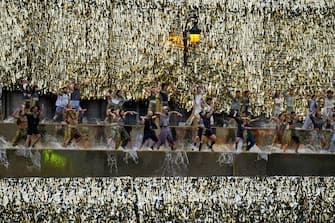 TOPSHOT - Performers dance along the banks of the Seine River during the opening ceremony of the Paris 2024 Olympic Games in Paris on July 26, 2024. (Photo by Petros Giannakouris / POOL / AFP) (Photo by PETROS GIANNAKOURIS/POOL/AFP via Getty Images)