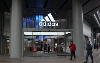 NANJING, CHINA - NOVEMBER 5, 2020 - Citizens walk past an Adidas advertisement at the door of a department store in Nanjing, East China's Jiangsu Province, Nov. 5, 2020. - (Photo credit should read Costfoto/Future Publishing via Getty Images)