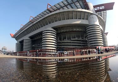 MILAN, ITALY - FEBRUARY 11: A general view of San Siro Stadium with only few fans before the AC Milan v Livorno serie A match on February 11, 2007 in Milan, Italy. Turnstiles have been installed and only AC Milan fans with season tickets will be allowd to watch the match. The security measures were installed after an officer was killed during riots at previous game in Sicily, Italy.  (Photo by Getty Images)