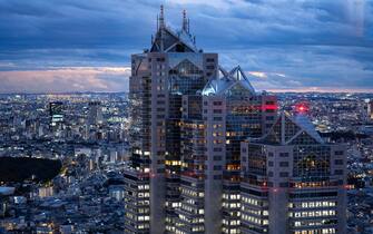 Tokyo, Japan. 24th Nov, 2022. The Shinjuku cityscape looking at the Park Hyatt Tokyo Hotel with the Tokyo city skyline viewed from the Tokyo Metropolitan Government Building No. 1 Observatory in Nishi-Shinjuku at sunset. Japan has recently reopened to tourism after over two years of travel bans due to the COVID-19 pandemic. The Yen (JPY) has greatly depreciated against the USD US Dollar, creating economic turmoil for international trade and the Japanese economy.Business, international trade, Japanese Government, Japan Government, Urban, megacity, megapolis, Tokyo Metropolitan Area, east