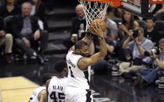 SAN ANTONIO, TX - JUNE 11:  Tracy McGrady #1 of the San Antonio Spurs gains the ball control during Game Three of the 2013 NBA Finals between the Miami Heat and the San Antonio Spurs on June 11, 2013 at AT&T Center in San Antonio, Texas. NOTE TO USER: User expressly acknowledges and agrees that, by downloading and or using this photograph, User is consenting to the terms and conditions of the Getty Images License Agreement. Mandatory Copyright Notice: Copyright 2013 NBAE (Photo by Issac Baldizon/NBAE via Getty Images)