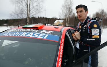 Craig Breen of Ireland stands by his Hyundai i20 N Rally1 HYBRID during the shakedown of the Rally Sweden, second round of the FIA World Rally Championship on February 9, 2023 in Hakmark, north of Umea, Sweden. - - Sweden OUT (Photo by Micke FRANSSON / TT NEWS AGENCY / AFP) / Sweden OUT (Photo by MICKE FRANSSON/TT NEWS AGENCY/AFP via Getty Images)