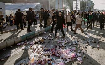 01/03/2024 Kerman, Iran. People disperse near the scene where explosions occurred on January 3, 2024, in Kerman, Iran.
Two explosions left more than 100 dead people on the anniversary slain Gen. Qassem Soleimani near his tomb in the Iranian city of Kerman. (Photo by Mahdi / Middle East Images / Middle East Images via AFP)