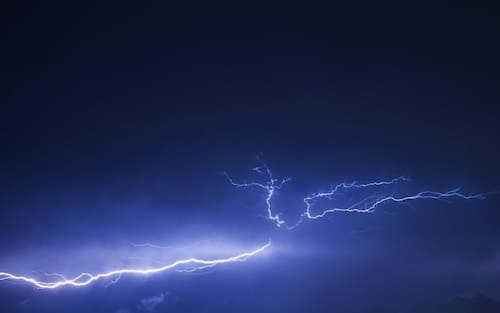 TOPSHOT - This photograph taken on July 22, 2022 shows a lightning over the Tennengebirge mountain range in Salzburg. - Austria OUT (Photo by BARBARA GINDL / APA / AFP) / Austria OUT (Photo by BARBARA GINDL/APA/AFP via Getty Images)