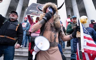 January 6, 2021, Washington, District of Columbia, USA: Among the supporters of President Trump who mobbed their way into the U.S. Capitol, one in his fur, horned hat and painted face, was Jacob Anthony Chansley, a.k.a JAKE ANGELI, a QAnon supporter who has been a fixture at Arizona right-wing political rallies over the past year. Rioters swarmed Capitol Hill as Congress voted to affirm the election victory of President-elect Biden over President Trump. Rioters breached all security barriers, went up the Hill's stairs reserved for Congressional members, and stormed the Senate floor.  (Credit Image: © Douglas Christian/ZUMA Wire)