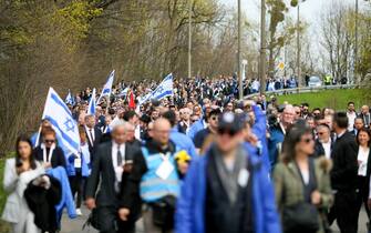 epa10578646 Participants during the  March of the Living  along the 'road of death' from the former Nazi German Auschwitz I camp to Auschwitz II-Birkenau in Oswiecim, Poland, 18 April 2023. The annual march, commemorating the victims of the Holocaust, takes place annually since 1988 at the site of Nazi German concentration and extermination camp Auschwitz-Birkenau. Over 1.1 million people, mostly Jews, lost their lives in Auschwitz death camps during the World War II.  EPA/ZBIGNIEW MEISSNER POLAND OUT