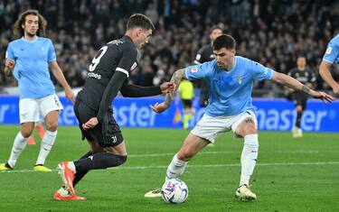 SS Lazio's Alessio Romagnoli (R) vies for the ball with Juventus'  Dusan Vlahovic during the Italian Cup semifinal 2nd leg soccer match between SS Lazio and Juventus FC at the Olimpico stadium in Rome, Italy, 23 April 2024.  ANSA/ETTORE FERRARI