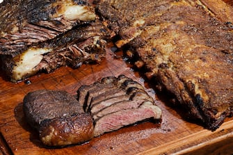 ROCKVILLE, MD - SEPTEMBER 12: Clockwise from top left: beef ribs, pork ribs, and picanha (sirloin cap), at the food truck Fire Pit Brazilian BBQ photographed in Rockville, Maryland on September 12, 2023. (Photo by Deb Lindsey for The Washington Post via Getty Images).