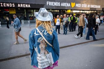 A fan of US musician Beyonce poses with her hand made jacket as she about to enter to the Friends Arena to watch her first concert of the World Tour named "Renaissance", in Solna, north of Stockholm on May 10, 2023. Droves of fans were lined up on May 10, 2023 outside the Friends Arena in Stockholm, eagerly awaiting music royalty Beyonce, who marked the first concert on her new tour. The "Renaissance World Tour," which was announced in February after being teased last autumn, is the seminal star's first solo tour since 2016. (Photo by Jonathan NACKSTRAND / AFP) (Photo by JONATHAN NACKSTRAND/AFP via Getty Images)