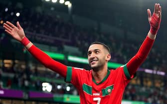 Morocco's Hakim Ziyech celebrates after winning the penalty shoot-out of the FIFA World Cup Round of Sixteen match at the Education City Stadium in Al-Rayyan, Qatar. Picture date: Tuesday December 6, 2022.