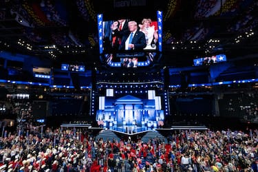 UNITED STATES - JULY 16: Former President Donald Trump is seen raising his fist on the jumbotron in the Fiserv Forum at the Republican National Convention in Milwaukee on Tuesday, July 16, 2024. (Bill Clark/CQ-Roll Call, Inc via Getty Images)