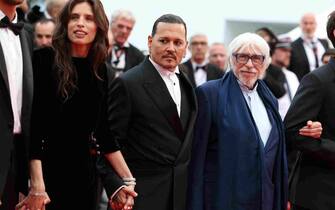 CANNES, FRANCE - MAY 16: (L-R) Maïwenn, Johnny Depp, Pierre Richard attend the "Jeanne du Barry" Screening & opening ceremony red carpet at the 76th annual Cannes film festival at Palais des Festivals on May 16, 2023 in Cannes, France. (Photo by Pascal Le Segretain/Getty Images)