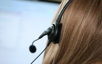 young woman working in modern call centre