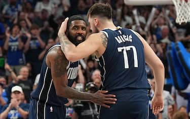 DALLAS, TX - MAY 11:  Kyrie Irving #11 of the Dallas Mavericks & Luka Doncic #77 of the Dallas Mavericks embrace during the game against the Oklahoma City Thunder during Round 2 Game 3 of the 2024 NBA Playoffs  on May 11, 2024  at the American Airlines Center in Dallas, Texas. NOTE TO USER: User expressly acknowledges and agrees that, by downloading and or using this photograph, User is consenting to the terms and conditions of the Getty Images License Agreement. Mandatory Copyright Notice: Copyright 2024 NBAE (Photo by Glenn James/NBAE via Getty Images)