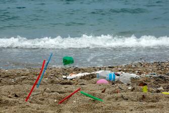 ATHENS, GREECE - JUNE 26: Plastic garbage lying on the Aegean sea beach near Athens on June 26, 2018 , Greece . The Mediterranean is one of the seas with the highest levels of plastic pollution in the world .More than 200 million tourists visit the Mediterranean each year causing the 40% increase in marine litter during summer  using  single use plastics including straws and stirrers, plastic cups, water bottles , inflatable pool toys etc which   leads to the general pollution of water and beaches along Mediterranean. (Photo by Milos Bicanski/Getty Images)