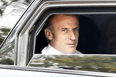 France's President Emmanuel Macron leaveS by car after voting in the second round of France's legislative election at a polling station in Le Touquet, northern France on July 7, 2024. France votes in legislative elections on July 7, 2024 that will be decisive in determining its political future and could see the far right become the largest party in parliament for the first time. (Photo by MOHAMMED BADRA / POOL / AFP) (Photo by MOHAMMED BADRA/POOL/AFP via Getty Images)