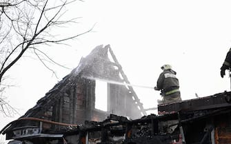 epa11238528 ?A handout photo made available on the Governor of the Belgorod Region Vyacheslav Gladkov's telegram channel, shows a firefighter extinguishing a fire in a house in Belgorod (650? km from Moscow), Russia, 23 March 2024. According to the governor, as a result of the Ukrainian air attack, one person was killed and several others were injured. Damage was reported in 69 apartments in 14 buildings, in four private residential buildings and three business entities. Eight cars and one passenger bus were also damaged, according to the governor.  EPA/BELGOROD GOVERNOR VYACHESLAV GLADKOV TELEGRAMM CHANNEL/HANDOUT  HANDOUT EDITORIAL USE ONLY/NO SALES HANDOUT EDITORIAL USE ONLY/NO SALES