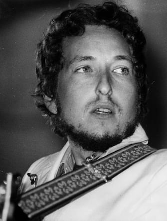 August 1969:  American electric folk hero Bob Dylan (born Robert Zimmerman) performing at the Isle of Wight Festival.  (Photo by Ian Tyas/Keystone/Getty Images)