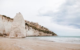Italy, Puglia, Vieste, Scialara beach with Pizzomuno rock