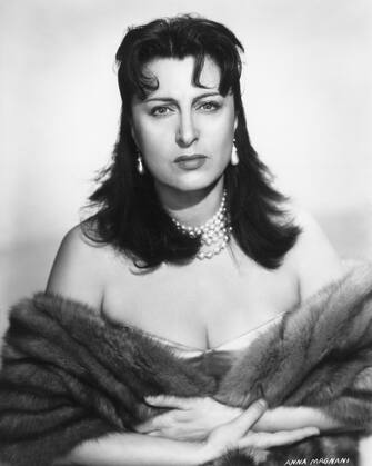 (Original Caption) 1955: Anna Magnani featured in a publicity photograph for the Hal Wallis production "The Rose Tattoo," directed by Daniel Mann. She won an Academy Award for her role in this version of the Tennessee Williams play.