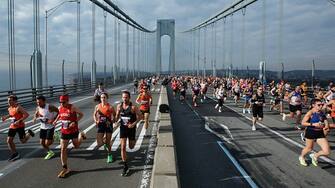 Runners cross the Verrazano Bridge before competing in the Men's division during the 52nd Edition of the New York City Marathon on November 5, 2023. (Photo by Kena Betancur / AFP) (Photo by KENA BETANCUR/AFP via Getty Images)