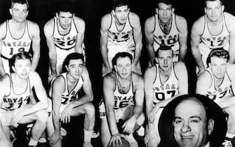 ROCHESTER -  NEW YORK - 1951: The World Champions of basketball, the Rochester Royals pose for a team portrait in 1951 front row (L-R): Bob Davies, Bob Wanzer, William Holtzman, Paul Noel, Frank Saul, Rear row: Bill Calhoun, Joe McNamee, Arnold Risen, Jack Coleman, Arnold Johnson, inset head coach Lester Harrison in Rochester, New York. NOTE TO USER: User expressly acknowledges  and agrees that, by downloading and or using this  photograph, User is consenting to the terms and conditions of the Getty Images License Agreement. Mandatory copyright notice: Copyright NBAE 2002 (Photo by NBAPhotos/ NBAE/ Getty Images)