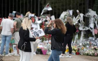 Sixth day after the death of Alain Delon at his estate in Douchy at around 3am on Sunday August 18, 2024, fans of Alain Delon take a photo in front of one of the flower-covered entrances to his estate, in Douchy, France on August 23, 2024. Photo by Florian Poitout/ABACAPRESS.COM