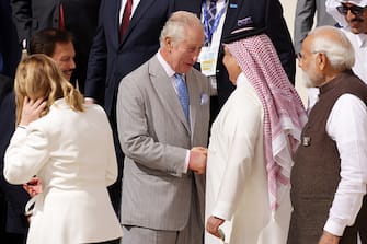 DUBAI, UNITED ARAB EMIRATES - DECEMBER 01: King Charles III (C) greets fellow heads of state as he prepares for a family photo during day one of the high-level segment of the UNFCCC COP28 Climate Conference at Expo City Dubai on December 01, 2023 in Dubai, United Arab Emirates. The COP28, which is running from November 30 through December 12, brings together stakeholders, including international heads of state and other leaders, scientists, environmentalists, indigenous peoples representatives, activists and others to discuss and agree on the implementation of global measures towards mitigating the effects of climate change. (Photo by Sean Gallup/Getty Images)