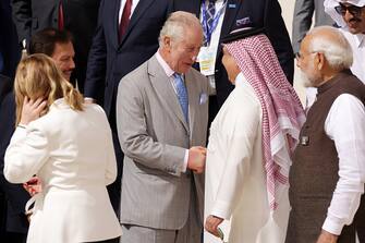 DUBAI, UNITED ARAB EMIRATES - DECEMBER 01: King Charles III (C) greets fellow heads of state as he prepares for a family photo during day one of the high-level segment of the UNFCCC COP28 Climate Conference at Expo City Dubai on December 01, 2023 in Dubai, United Arab Emirates. The COP28, which is running from November 30 through December 12, brings together stakeholders, including international heads of state and other leaders, scientists, environmentalists, indigenous peoples representatives, activists and others to discuss and agree on the implementation of global measures towards mitigating the effects of climate change. (Photo by Sean Gallup/Getty Images)