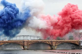 PARIS, FRANCE - JULY 26: Smoke resembling the flag of Team France is shown over Austerlitz Bridge during the opening ceremony of the Olympic Games Paris 2024 on July 26, 2024 in Paris, France. (Photo by Kevin C. Cox/Getty Images)