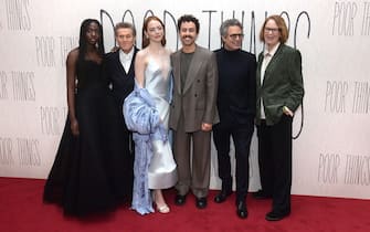 LONDON, ENGLAND - DECEMBER 14: (L-R) Suzy Bemba, Willem Dafoe, Emma Stone, Ramy Youssef, Mark Ruffalo and Vicki Pepperdine attend the UK Gala Screening of Searchlight Pictures' 'Poor Things' at the Barbican Centre in London, on December 14, 2023. (Photo by Eamonn M. McCormack/Getty Images for Walt Disney Studios Motion Pictures UK)