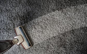 Close-up Of man  using A Vacuum Cleaner professional vacuum cleaner