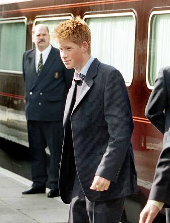 STEP00090402630A
PAP01 - 20000904 - NORTHAMPTON, UNITED KINGDOM : Prince Harry, Monday 04 September 2000, arrives at Northampton train station after travelling down from Balmoral with his father, who was opening one of the country's largest mental health facilities for adolescents in Northampton. Harry stopped to wave to crowds at Northampton, and then went on to Highgrove by car. Prince Charles officially opened the new unit, which is called the Lowther Building, at St Andrew's Hospital, Northampton.  
EPA PHOTO ROTA/STR/hh