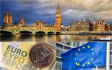veduta di londra, un euro e una bandiera dell'europa
