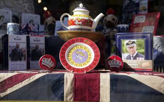 King Charles III and coronation merchandise on display in a shop window near to Windsor Castle in Windsor, Berkshire. Preparations are underway across the UK for the coronation on May 6. Picture date: Thursday April 13, 2023.