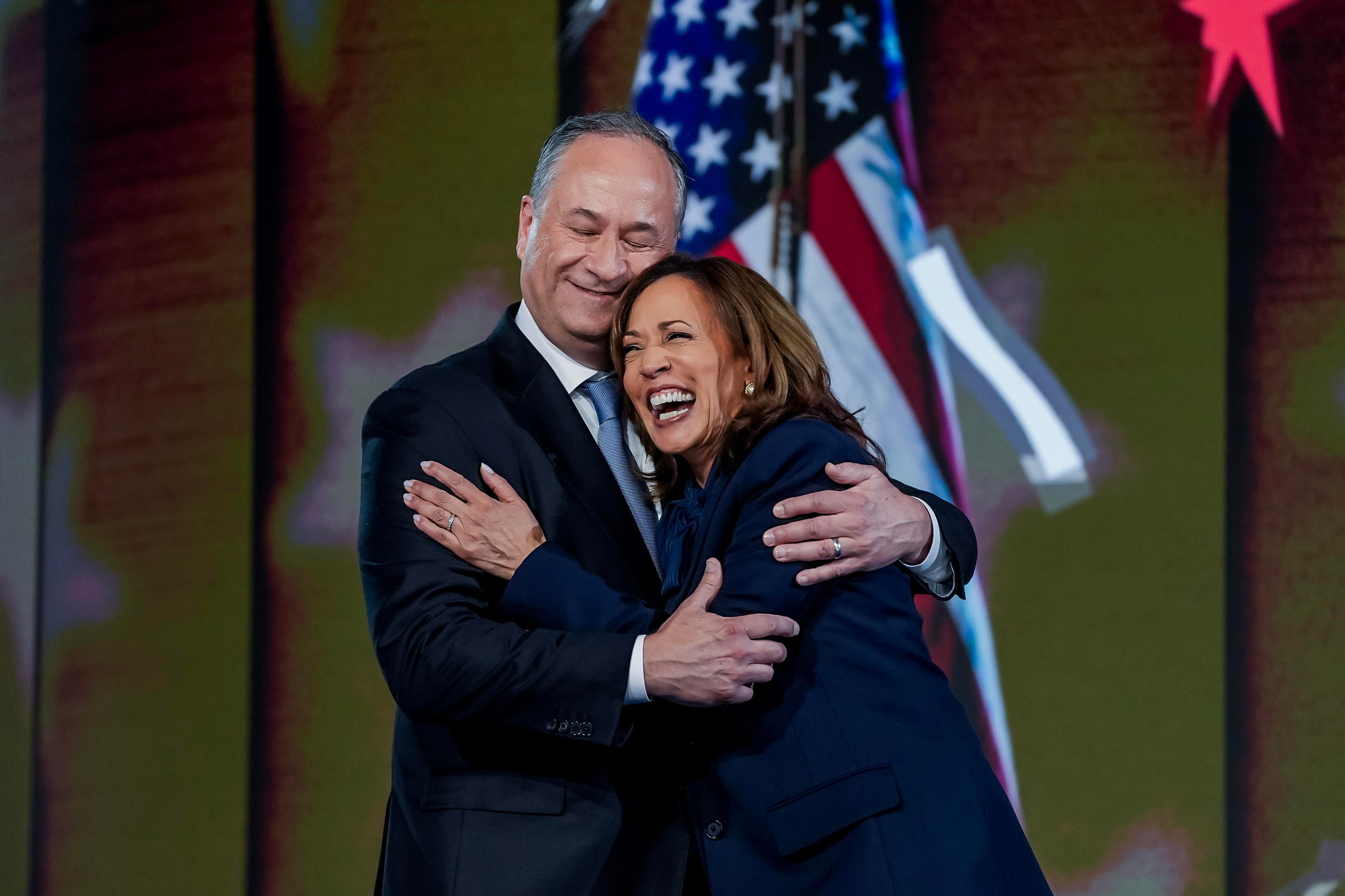 epa11561035 Democratic presidential nominee and US Vice President Kamala Harris (R) and her husband Second Gentleman Doug Emhoff (L) embrace on stage after she spoke during the final night of the Democratic National Convention (DNC) at the United Center in Chicago, Illinois, USA, 22 August, 2024. The 2024 Democratic National Convention is being held from 19 to 22 August 2024, during which delegates of the United States' Democratic Party will vote on the party's platform and ceremonially vote for the party's nominee for president, Vice President Kamala Harris, and for vice president, Governor Tim Walz of Minnesota, for the upcoming presidential election.  EPA/WILL OLIVER