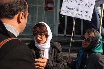 TEHRAN, IRAN - DECEMBER 14, 2014: Human rights lawyer Nasrin Sotoudeh photographed while talking to supporters outside the bar association during her daily sit-in protesting the decision of the authorities to ban her from law practice on December 14, 2014 in Tehran, Iran. Nasrin Sotoudeh is a human rights lawyer who has represented imprisoned Iranian opposition activists and politicians following the disputed June 2009 Iranian presidential elections as well as prisoners sentenced to death for crimes committed when they were minors. Sotoudeh was arrested in September 2010 on charges of spreading propaganda and conspiring to harm state security and was imprisoned in solitary confinement in Evin Prison. In January 2011, Iranian authorities sentenced Sotoudeh to 11 years in prison, in addition to barring her from practicing law and from leaving the country for 20 years. An appeals court later reduced Sotoudeh's prison sentence to six years, and her ban from working as a lawyer to ten years. On 26 October 2012, Sotoudeh was announced as a co-winner of the Sakharov Prize of the European Parliament. She shared the award with Iranian film director Jafar Panahi. Sotoudeh was released on 18 September 2013 along with ten other political prisoners, including opposition leader Mohsen Aminzadeh, days before an address by Iranian President Hassan Rouhani to the United Nations. No explanation was given for her early release. (Photo by Kaveh Kazemi/Getty Images)